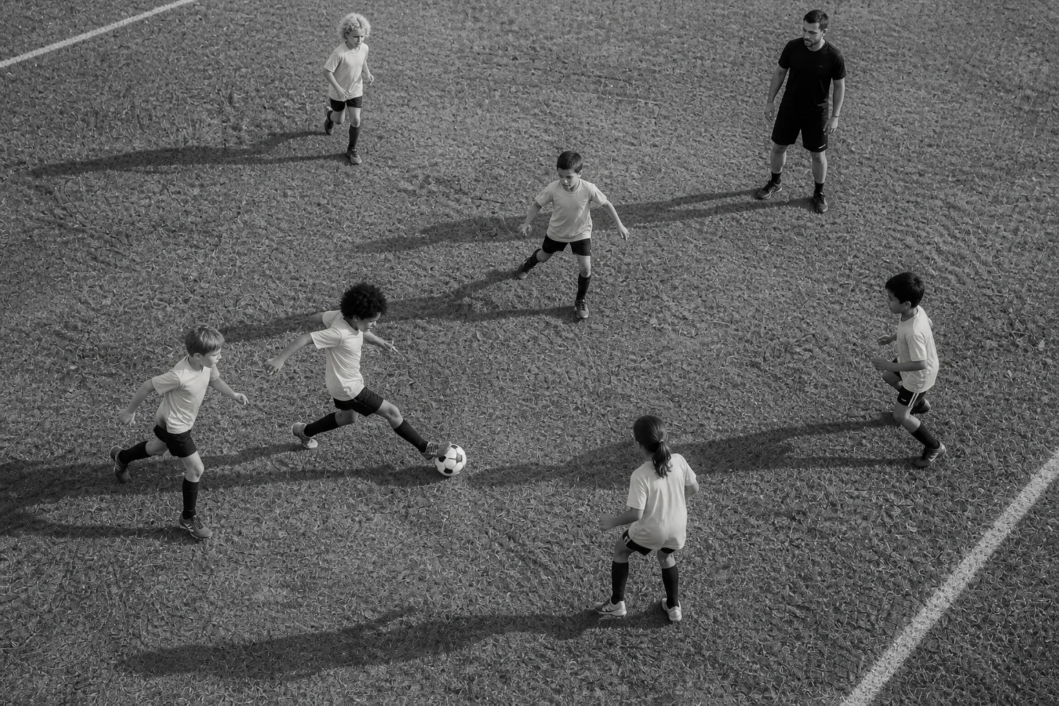 Overhead view of youth players moving through a small-sided soccer drill